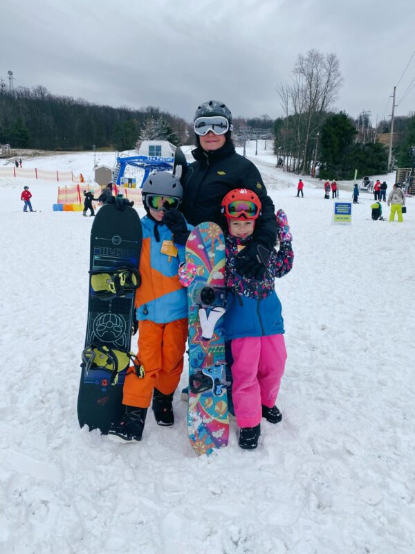 Family posing on the ski slope