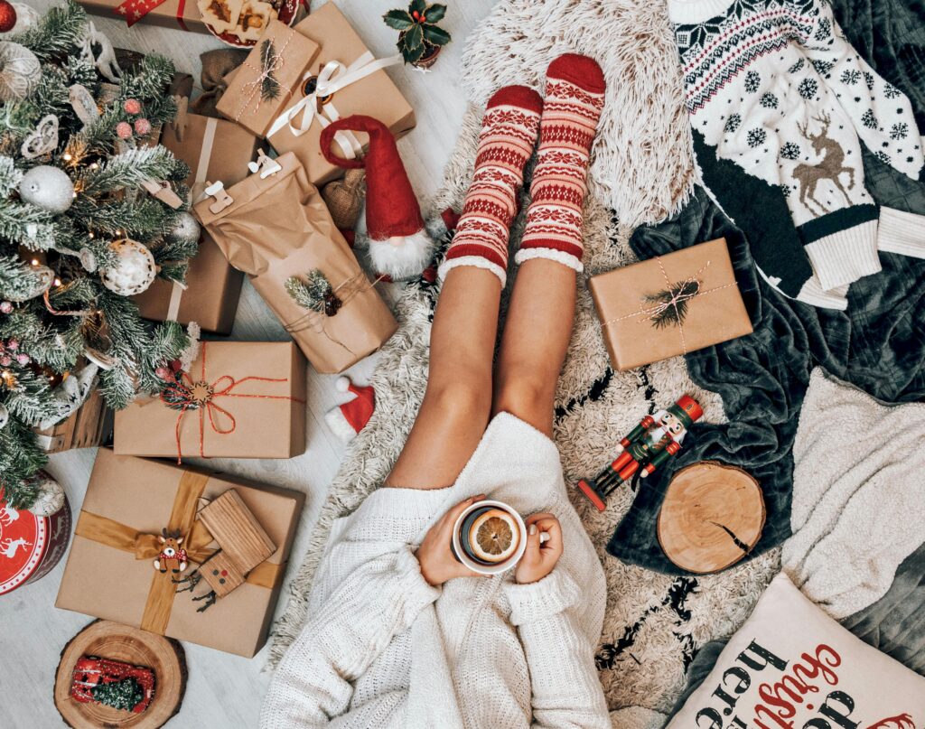 Woman surrounded by Christmas presents